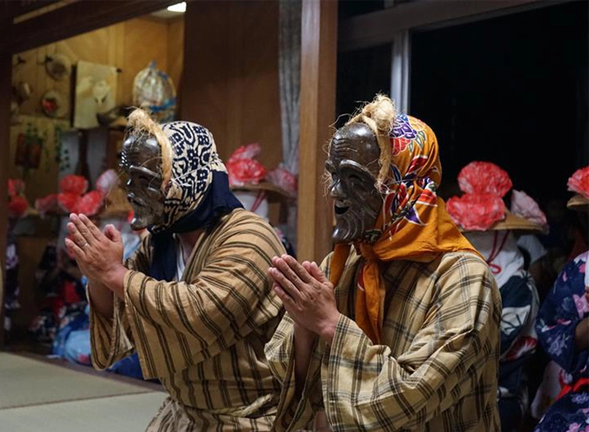 masked dancers honoring ancestors