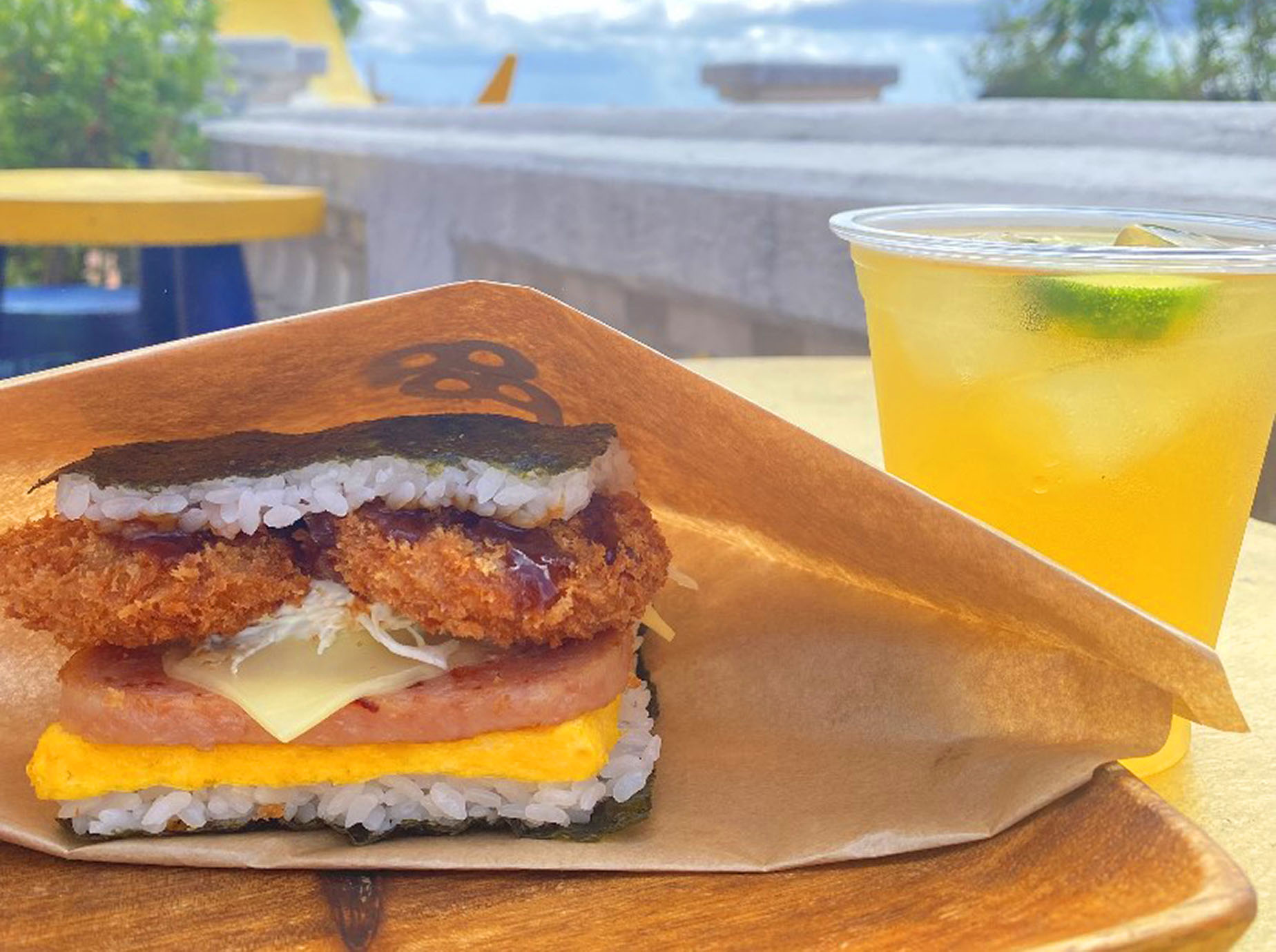 a rice ball sandwich with a drink