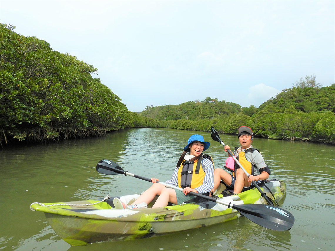 two people kayaking downriver