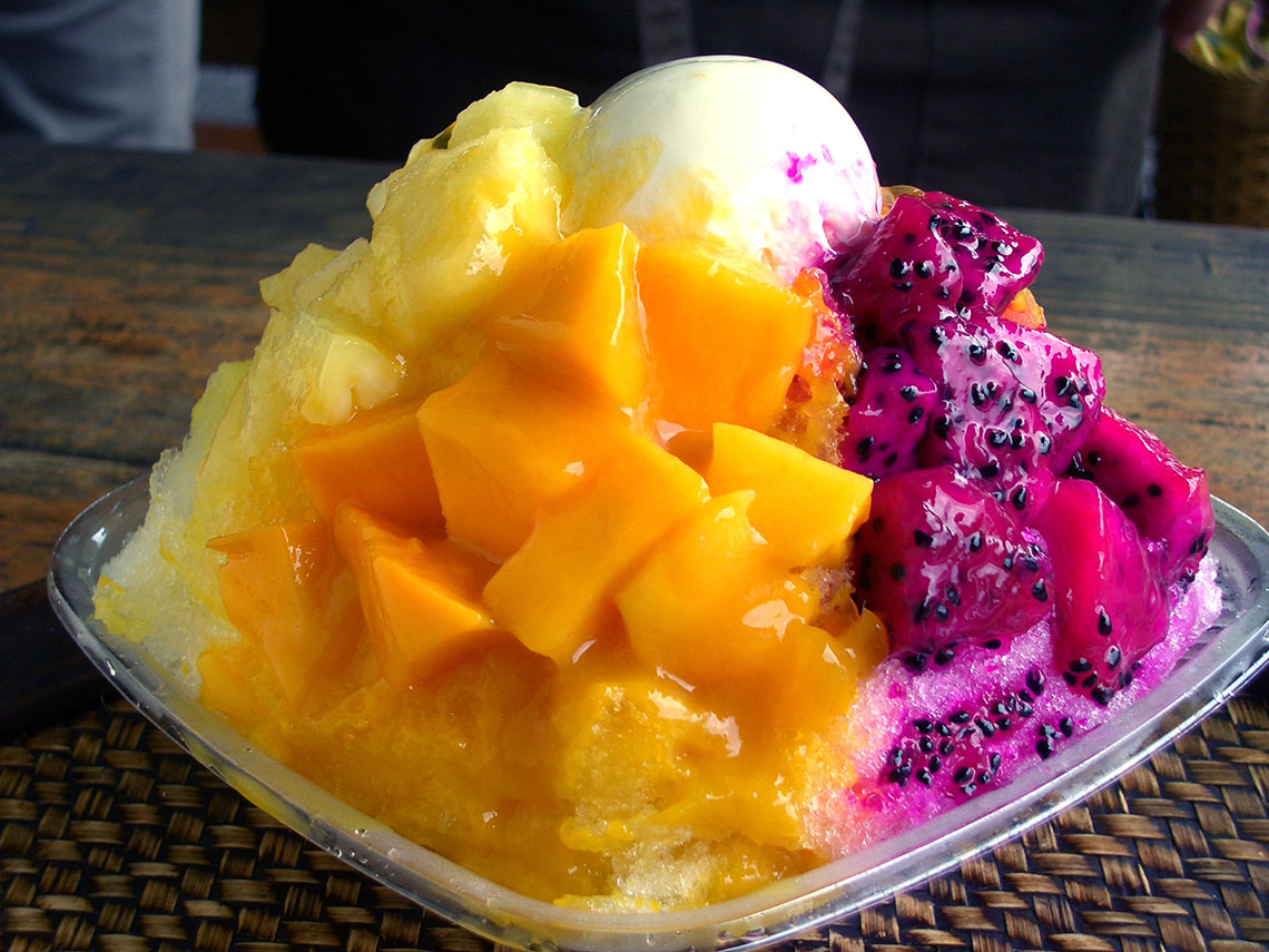 shaved ice topped with mango and passionfruit