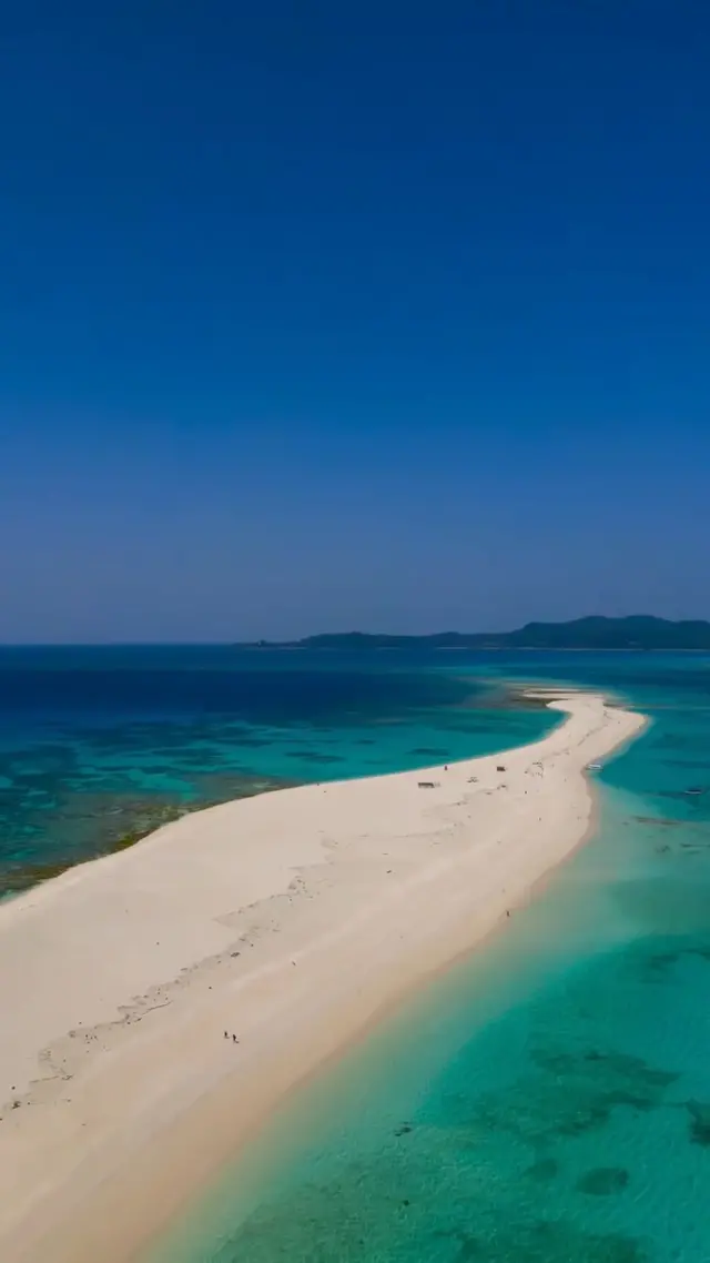 Where White Meets Blue 🤍💙

📍 Hatenohama Beach, Kume Island

Floating off the coast of Kume Island, this stretch of white sand feels almost unreal🌊

An island made only of sand. No buildings. No roads.
Just sea and sky meeting in endless shades of blue and white.

In winter, when the air is clear and the weather steady☀️, the water’s color feels even more vivid. There is little sound. Little movement. Just space to breathe🌬️

Sometimes, nothing is what stays with you the longest ✨

📸  Reel by @takepipipiro
Have your own Okinawa memories to share?
Tag your Okinawa moments with #visitokinawajapan and #beokinawa for a chance to be featured!

#Okinawa #Okinawaprefecture #Visitokinawa #Exploreokinawa #Discoverokinawa #Okinawasggo #Okinawabeach #Relaxing #Relaxingbeach #Relaxingtrip #Kumeisland #Kumejima #Okinawaisland #Islandlife #Relaxingisland #Clearskies #Peaceful #Peacefulretreat #Okinawalovers #Beachlovers #Islandlovers #Seaside #Sealovers #Islandtravel #Peacefultravel